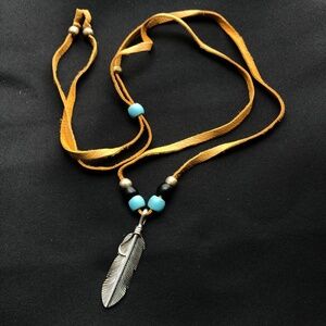custom made leather and sterling silver feather with African glass beads